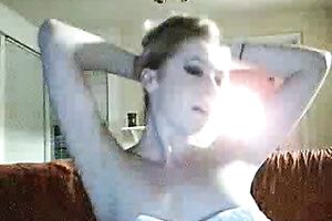 Playful blondie on the daybed shows her vagina and masturbates