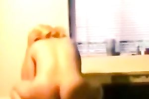 Blond haired large bottomed white lady is fond of riding man's prick