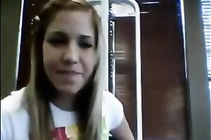 Seductive co-ed takes her clothing off in front of the camera