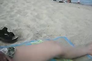 My barefaced white bitch masturbates her bald pussy on the beach