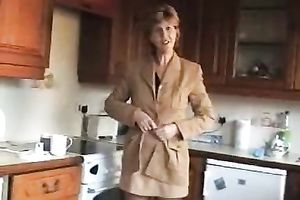 Lusty blond older hotwife Sara shows off her goodies in kitchen