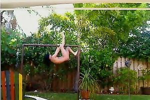 Tight gymnast playgirl works out on horizontal bar absolutely stripped