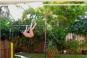 Tight gymnast playgirl works out on horizontal bar absolutely stripped