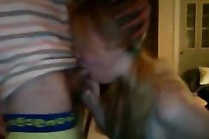 Pigtailed cute auburn girlie provided her favourable BF with BJ on cam