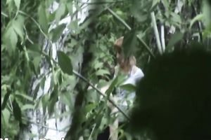 Blonde white Russian housewife in the high grass squats and piddles