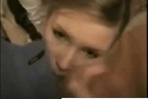 Adorable and miniature blond wench on her knees to eat a large jock