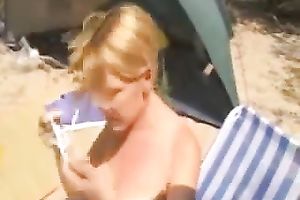 Blond haired amateur wife wanted to play with her tits during the time that sunbathing outdoors
