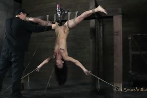 Hanging upside down unsightly dark brown receives love tunnel teased with fake penis