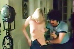 Raunchy looking skank lets her mustached paramour spoon her