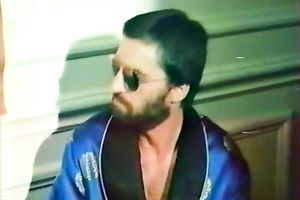 Raunchy looking skank lets her mustached paramour spoon her