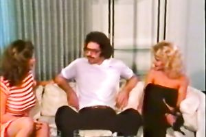 Two classic white women on the bed sharing one schlong