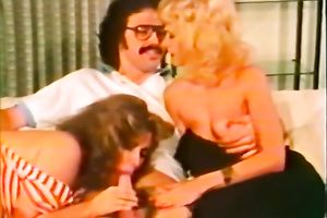 Two classic white women on the bed sharing one schlong