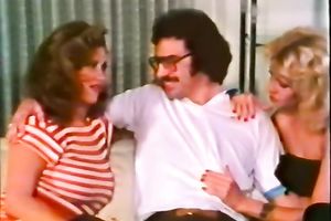 Two classic white women on the bed sharing one schlong