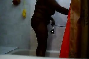 Chubby black skinned girl of my neighbour was taking a sexy shower