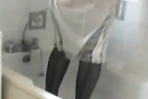 My small and cute aged wife in the washroom getting stripped