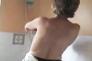 My small and cute aged wife in the washroom getting stripped