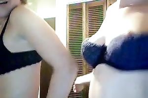 Two alike looking happily giggling angels kinda striptease for me on web camera