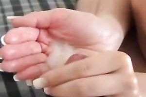 Girlfriend takes my load in her hand after a handjob and licks it
