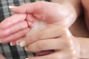 Girlfriend takes my load in her hand after a handjob and licks it