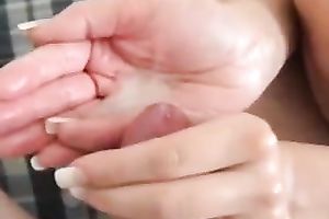 Girlfriend takes my load in her hand after a handjob and licks it