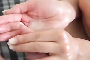 Girlfriend takes my load in her hand after a handjob and licks it