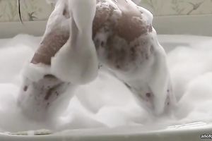 Big assed brunette sweetie sucks large fake pecker in washroom