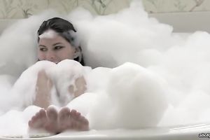 Big assed brunette sweetie sucks large fake pecker in washroom