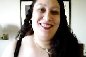 Mature mega breasty brunette hair girl shows off her juggs on home video