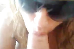 My impure curly haired floozy gives me head in hot sun shades