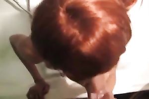 Red haired quite slender housewife with large boobs was engulfing my buddy in the baths