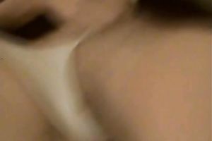 Lovely youthful dark babe with saggy love bubbles on the ottoman