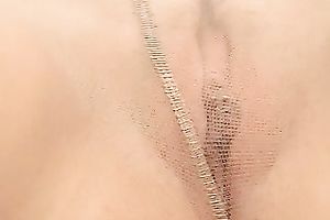 Fabulous chick with green eyes flashes her twat on the table