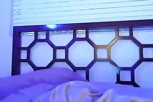 Ebony lean new beauty beneath magical blue lights on web camera