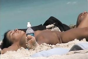 Beautiful dark brown youthful sweetheart on the beach feels nice