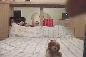 Lewd slender leggy light haired pigtailed girlie positions on her sofa