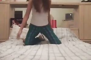 Lewd slender leggy light haired pigtailed girlie positions on her sofa