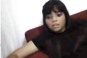 Black sweetheart rubs her fanny in bedroom throughout her pants