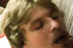 Redhead classic German playgirl giving head on the ottoman