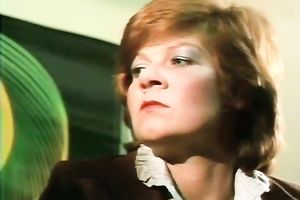 Redhead classic German playgirl giving head on the ottoman