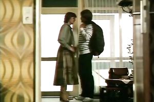 Redhead classic German playgirl giving head on the ottoman