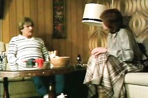 Redhead classic German playgirl giving head on the ottoman