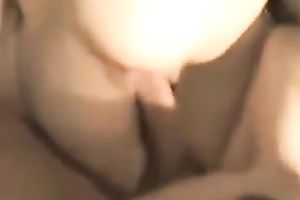 Lubricious dark brown gal in fishnet nylons serves her pussy for hard pounding