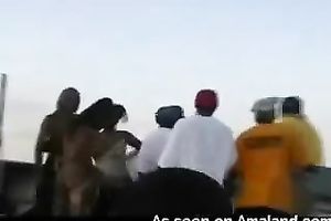 Dirty ebony doxies were engulfing dick in front of the crowd