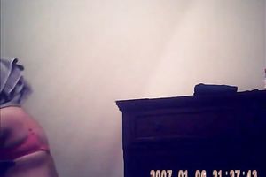 Hidden camera of lustful bulky dark brown putting on her raiment after shower