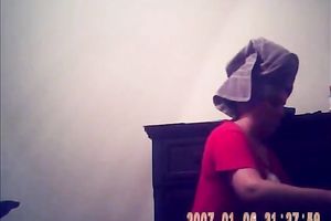 Hidden camera of lustful bulky dark brown putting on her raiment after shower