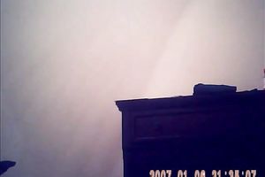 Hidden camera of lustful bulky dark brown putting on her raiment after shower