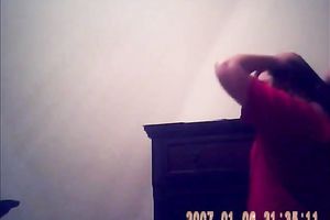 Hidden camera of lustful bulky dark brown putting on her raiment after shower