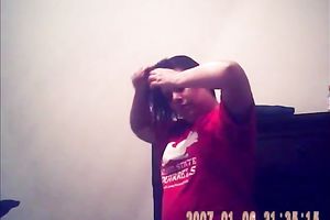 Hidden camera of lustful bulky dark brown putting on her raiment after shower