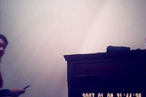 Hidden camera of lustful bulky dark brown putting on her raiment after shower