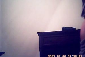 Hidden camera of lustful bulky dark brown putting on her raiment after shower